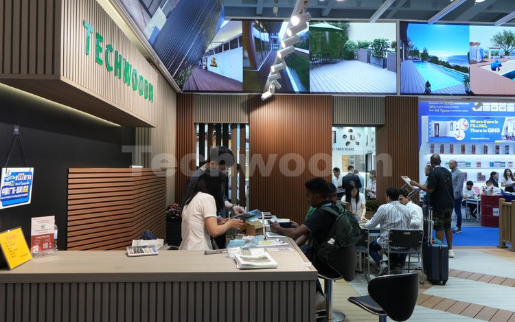 Techwoodn WPC product display and customer consultation at a trade show